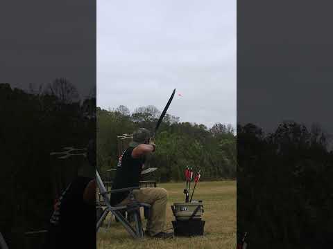 Clay trickshots of of a chair 🪑 with bow and slingshot #seated #archery #slingshot