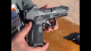 Kimber R7 Carbon Compact Pistol With Threaded Barrel and Red Dot on the range - FirearmsGuide.com