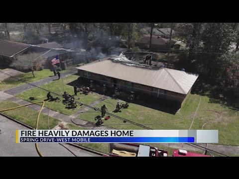 Fire badly damages home in West Mobile, injuring 1 man