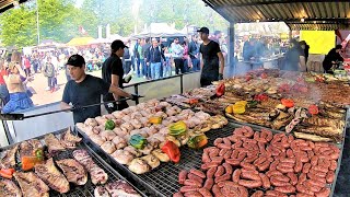 Street Food Fest in Milano, Italy. Grilled Meat, Burgers, Roasted and Pulled Pork, Pasta, Cheese