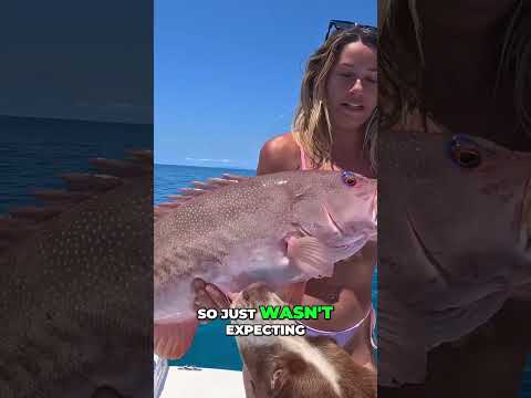 Epic Fishing Celebration: Dog, Woman, and a Big Catch!