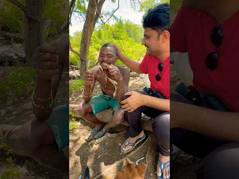 Hadzabe hunter eating bird #hadzabe #challenge #africa #wildlife #bird #adventure #hadzabetribe