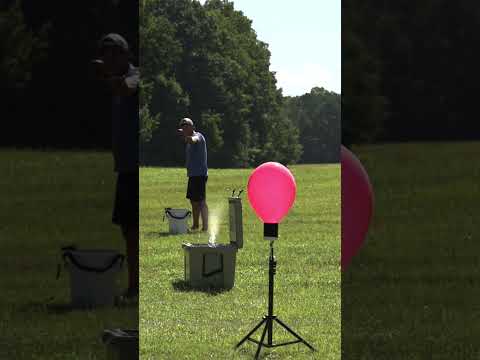 Skipping off of water to pop a balloon 🎈using a slingshot #slingshot #sling #water #sports